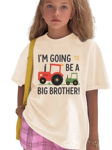 Detail of big brother announcement T-shirt with tractor print and cotton fabric texture