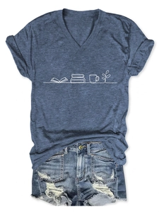 Flat lay of a grey V-neck T-shirt with book and cup print paired with denim shorts