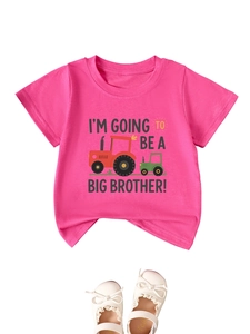 Detail of pink cotton T-shirt featuring cartoon tractor and big brother quote