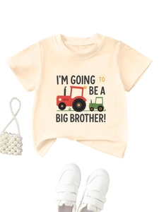 Detail of cotton kids t-shirt with tractor print and I'M GOING TO BE A BIG BROTHER text
