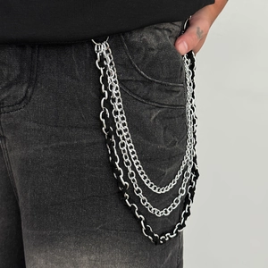 Detail of three-layer hip hop silver metal wallet chain with black woven texture cord