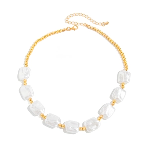 Baroque pearl necklace with gold CCB beads and lobster clasp on white background