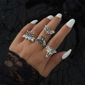 Gothic skull moth ring set with vintage silver finish on model hand with black lace