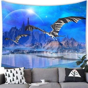 Detail of dragon tapestry hanging above a sofa showing fantasy mountain and planet landscape