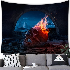Dark gothic wall tapestry with burning skull and ruins over a sofa in a living room