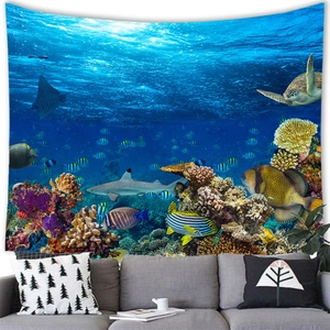Detail of a deep sea fish wall tapestry showing sharks and turtles over a grey sofa