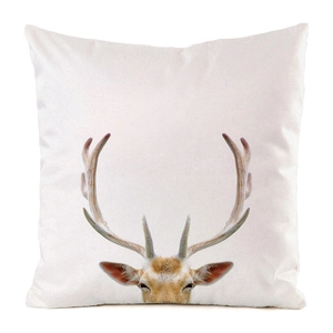 Macro detail of square faux silk cushion cover featuring a vivid deer head print design