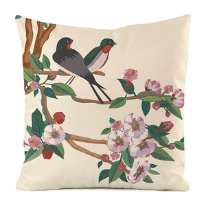 Detail of floral and bird print on faux silk pillowcase with cherry blossom design
