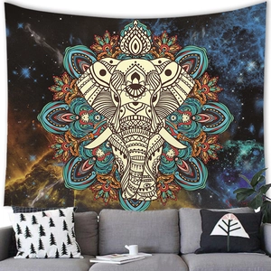 Cosmic Mandala Elephant tapestry hanging over a grey sofa in a modern living room setting