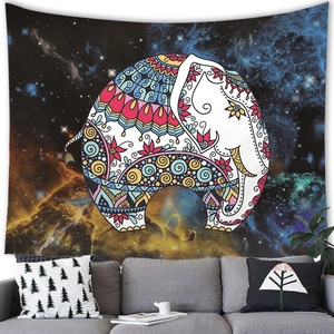 Detailed view of bohemian mandala elephant tapestry with galaxy stars on living room wall