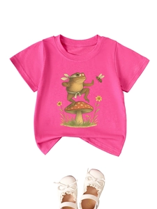 Close-up of pink cotton kids t-shirt with kung fu frog and mushroom graphic print
