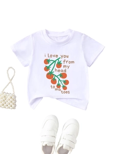 Close-up of kids white cotton t-shirt with tomato graphics and funny text print