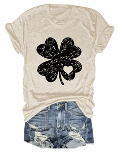 Detail of clover print on beige cotton T-shirt with vintage distressed heart pattern