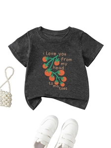 Flat lay of a grey cotton T-shirt featuring a tomato print and white velcro sneakers