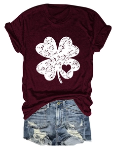 Detailed flat lay of burgundy crew neck clover t-shirt with distressed denim shorts