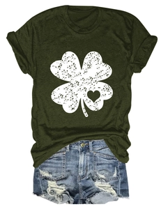 Detail of clover and heart print on olive green cotton t-shirt with denim shorts