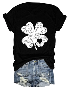 Detail of clover print with distressed texture on black crew neck short sleeve t-shirt
