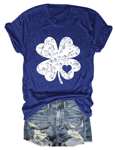 Detail of navy blue T-shirt with white clover heart print paired with distressed denim shorts