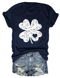 Detail view of navy t-shirt featuring a clover heart print with distressed denim shorts