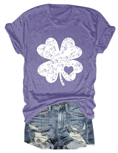 Detail of purple cotton T-shirt with vintage clover heart print and distressed denim shorts