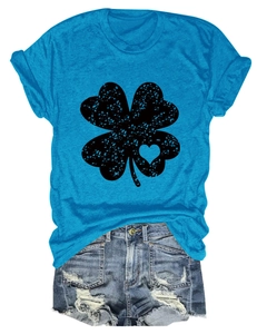 Flat lay of blue clover heart t-shirt paired with distressed denim shorts on white