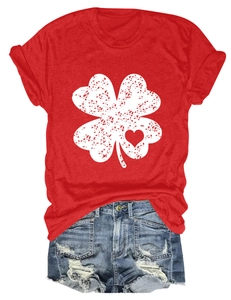 Detail of red clover print t-shirt paired with distressed denim shorts on white background