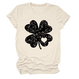 Detailed view of vintage four-leaf clover print with heart detail on beige t-shirt
