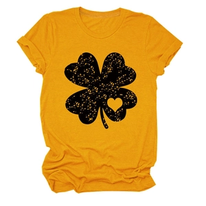 Detail of clover print on ginger yellow t-shirt with heart cutout and distressed texture