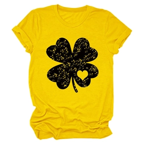 Close-up of heart-clover print on bright yellow crewneck short sleeve t-shirt fabric