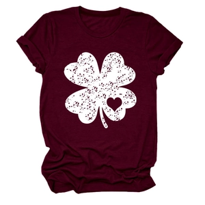 Detail of burgundy T-shirt showing white clover print with heart shape cutout texture