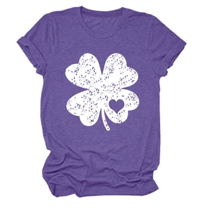 Close-up of heather purple t-shirt featuring a distressed white clover and heart print