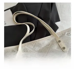 Close-up of jacquard fabric tote bag featuring floral patterns and leather handles