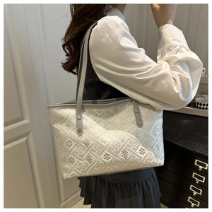 Close-up of new Chinese style tote bag featuring jacquard floral patterns and grey straps