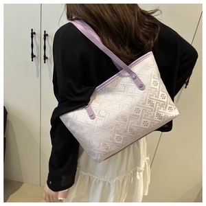 Detail of lavender jacquard fabric tote bag showing intricate geometric patterns and floral motifs