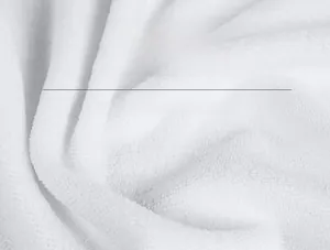 Close-up of soft white microfiber fabric texture with high fiber density on beach towel