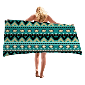 Bohemian geometric beach towel with turquoise and black patterns for beach vacation