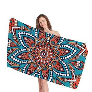 Ethnic mandala geometric pattern thick beach towel in turquoise and orange hues