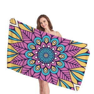 Thick beach towel featuring a colorful bohemian mandala pattern for summer vacations