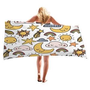 Microfiber beach towel with cartoon sun and moon patterns for travel and vacation