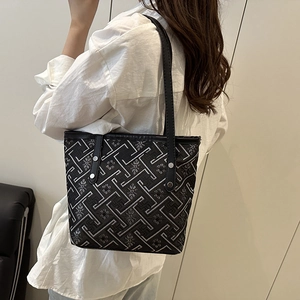 Large capacity black tote bag with silver floral embroidery and leather straps