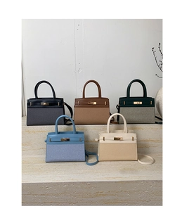 Detailed view of structured trapezoid handbags in five colors with woven textures