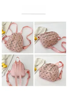 Detailed views of the pink mini backpack with cute black bear prints and dual zippers