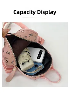 Interior view of pink printed backpack showing capacity for phone and power bank