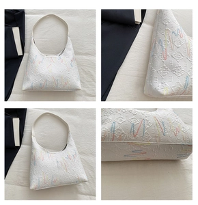 Detailed views of white hobo bag with monogram embossing and colorful embroidery