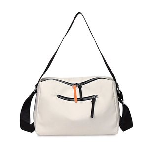Waterproof ivory nylon crossbody bag with black adjustable strap and orange zipper detail