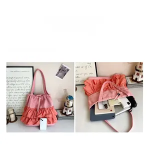 Detailed interior of a pink pleated canvas tote bag showing its large storage capacity