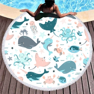 Round thick beach towel with cartoon sea animals, fringe edges and summer resort vibe