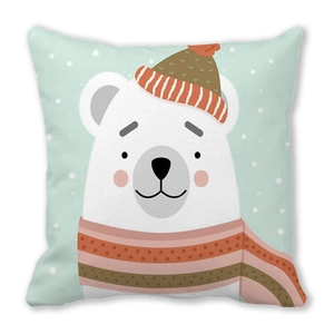 Detail of mint green square pillowcase featuring a cartoon polar bear in winter accessories