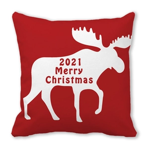 Détail de la taie d'oreiller de Noël rouge avec silhouette d'élan et lettrage festif