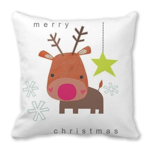Close-up of a white peach skin pillowcase featuring a cartoon reindeer and Merry Christmas text
